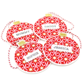 Four personalised round fabric ornaments with a red and white starburst pattern, each featuring a white label with a name (Mummy, Daddy, Sophie, Jessica) and a red-and-white string.