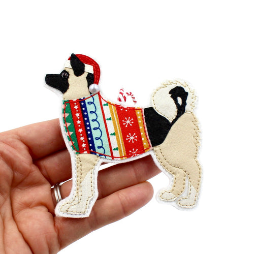 Handmade cotton and felt American Akita decoration, held in hand for size reference, perfect gift for pet lovers