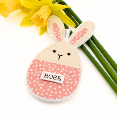 Bunny-shaped Easter decoration with 'ROSE' label on a white background