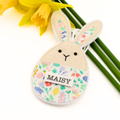 Floral-patterned bunny-shaped Easter decoration with 'MAISY' on a white background