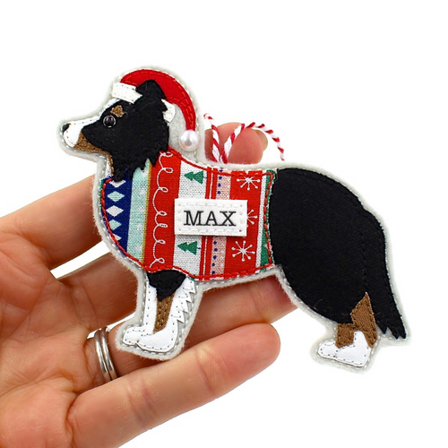 Personalised handmade cotton and felt Border Collie dog decoration with name, held in hand for size reference, perfect gift for pet lovers