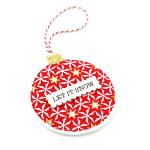 A personalised Christmas bauble decoration with red and white candy stripes, glitter, and felt fabrics, including a hanging twine.